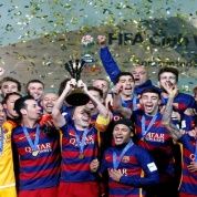F.C. Barcelona celebrate winning the FIFA Club World Cup Final with the trophy.